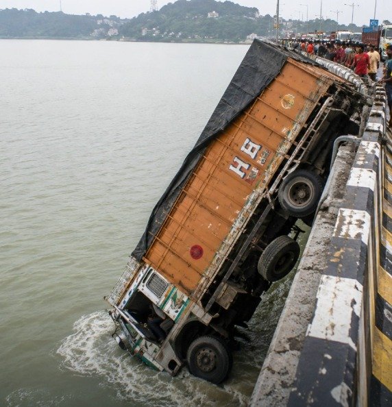 Truck Falls Off Saraighat Bridge After Driver Allegedly Falls Asleep | Latest News Guwahati